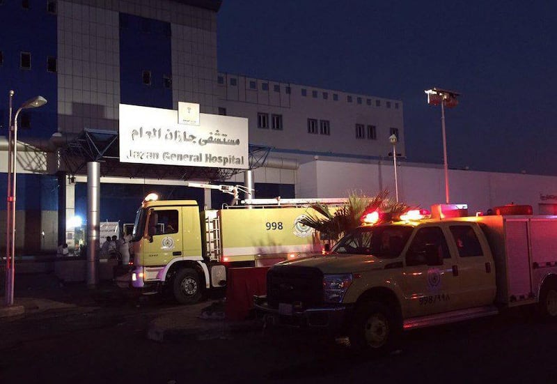 In this handout image uploaded on the official Twitter account of the directorate of the Saudi Civil Defense agency, firefighters gather outside the Jazan General Hospital after a blaze broke out in the intensive care unit and the maternity departmen on December 24. AFP Photo

