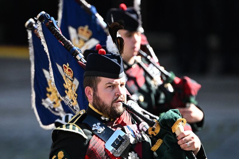 The Royal Company of Archers, the King's Bodyguard for Scotland, arrive at St Giles' Cathedral in Edinburgh. AFP