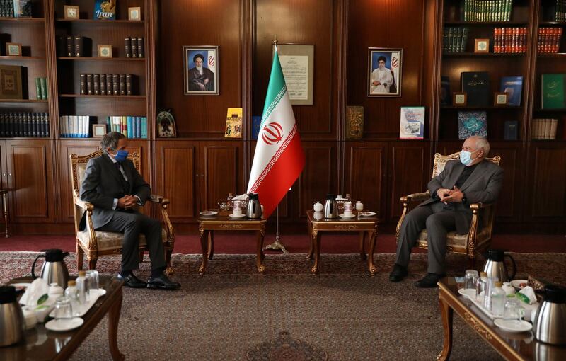 Director General of International Atomic Energy Agency, IAEA, Rafael Mariano Grossi, left, and Iran's Foreign Minister Mohammad Javad Zarif attend a meeting in Tehran, Iran, Tuesday, Aug. 25, 2020. Grossi arrived in Iran on Monday to press for access to sites where authorities are thought to have stored or used undeclared nuclear material. (AP Photo/Vahid Salemi)