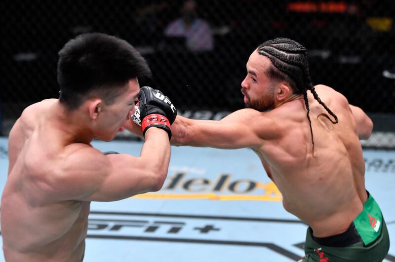 Kyler Phillips punches Song Yadong of China in their bantamweight fight during UFC 259 in Las Vegas, Nevada. USA TODAY Sports