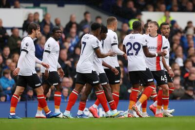 Tom Lockyer of Luton Town celebrates with teammates after scoring against Everton. Getty
