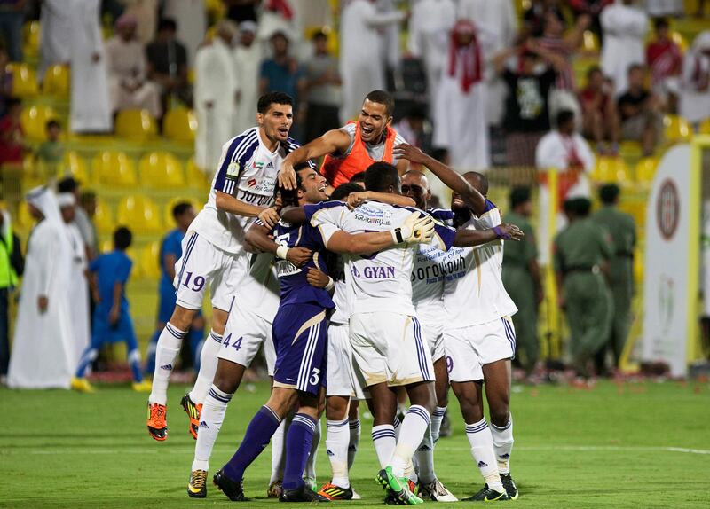 Dubai, United Arab Emirates, Sept 17 2012, Etisalat Cup, Jazira v Al Ain- Al Ain GK  Dawoud Sulaiman is swarmed by teammates  in the Etisalat Cup at Al Wasl stadium. Mike Young / The National
