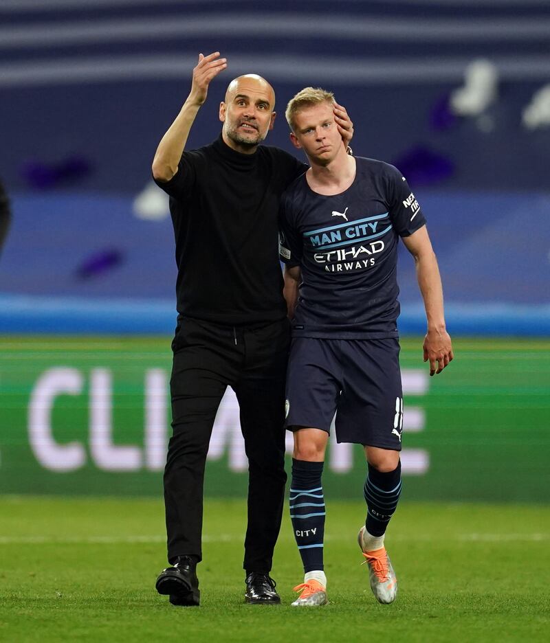 Manchester City manager Pep Guardiola consoles Oleksandr Zinchenko. PA