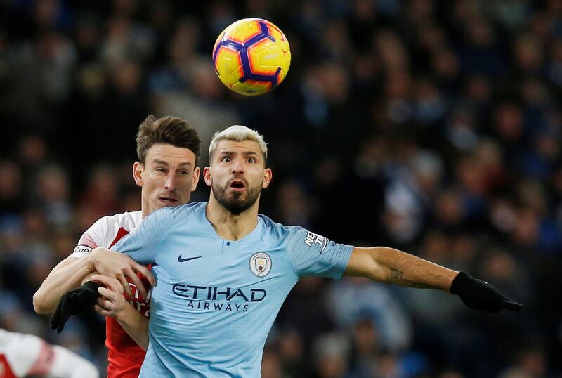 Aguero in action with Arsenal's Laurent Koscielny. Reuters