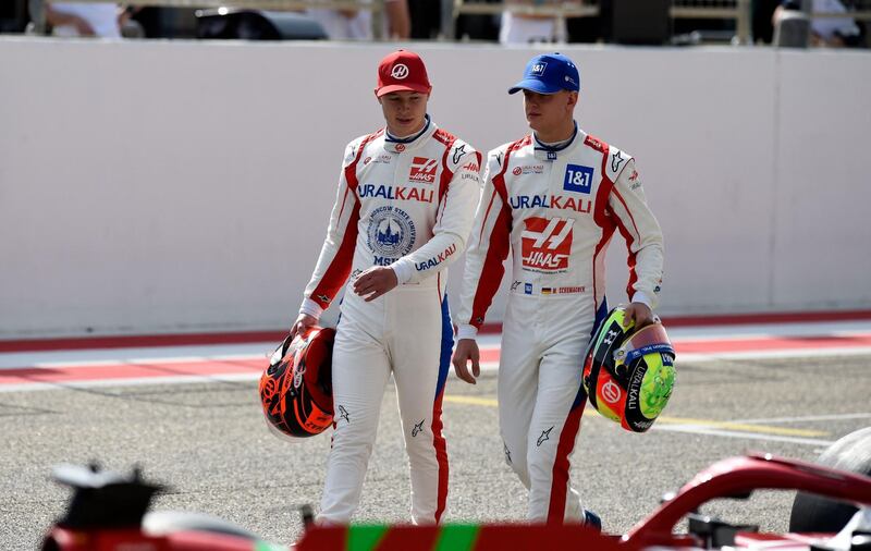 Haas driver Mick Schumacher chats with teammate Nikita Mazepin ahead of the first day of the Formula One pre-season testing at the Bahrain International Circuit. AFP