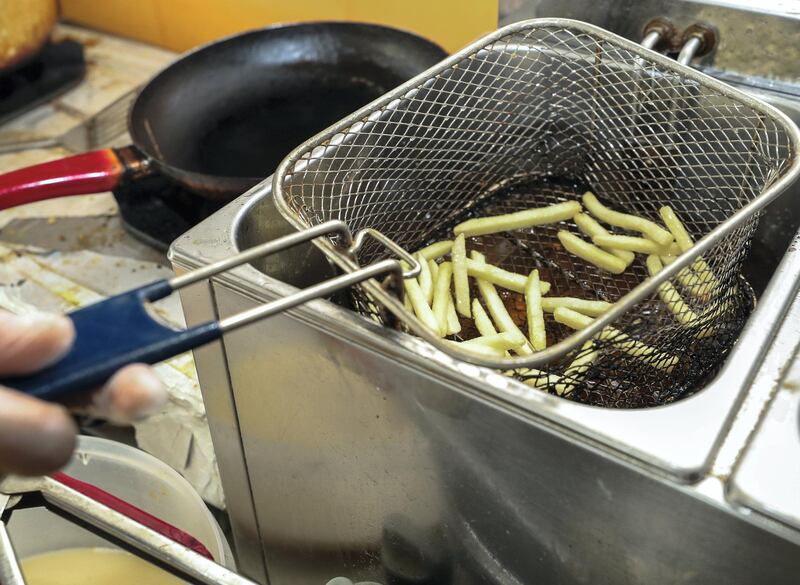 Abu Dhabi, UAE, April 2, 2018.   Desert Burger Cafeteria.  French fries being deep fried in the restaurant.
Victor Besa / The National
National
Reporter:  Ann Marie McQueen