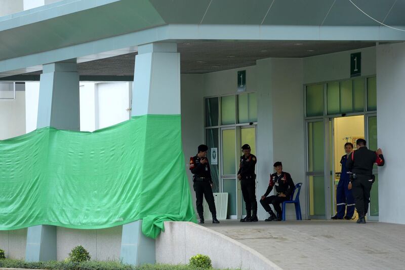 Thai police stand guard in front of the hospital. AFP