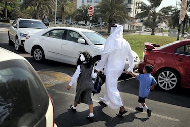 A parent drops off his children off at school. Delores Johnson / The National