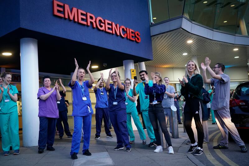 NHS staff participate in the "Clap For Our Carers" campaign, on April 9, 2020 in Liverpool, UK. Getty Images