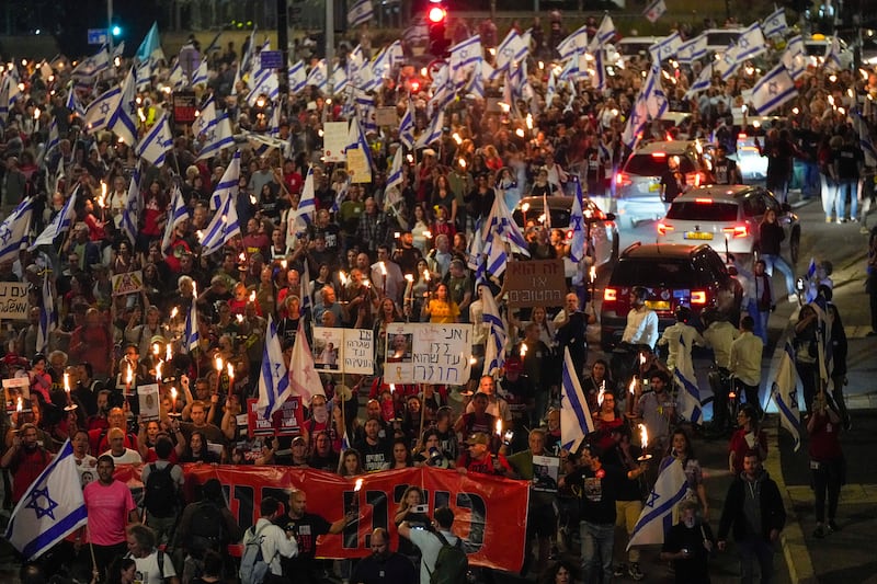 More than 100,000 Israelis marched across the country on Saturday, demanding their government make a deal with Hamas to release hostages. AP