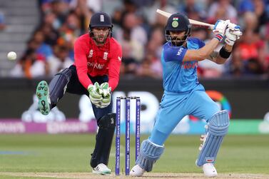 ADELAIDE, AUSTRALIA - NOVEMBER 10:  Virat Kohli of India and 
 Jos Buttler of England during the ICC Men's T20 World Cup Semi Final match between India and England at Adelaide Oval on November 10, 2022 in Adelaide, Australia. (Photo by Sarah Reed / Getty Images)