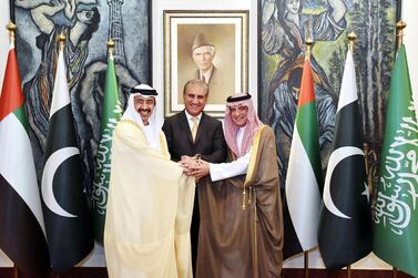 In this handout photograph taken and released by Press Information Department (PID) on September 4, 2019 Pakistani Foreign Minister Shah Mehmood Qureshi (C) joins hands with Saudi Foreign Minister Adel al-Jubeir (R) and United Arab Emirates Foreign Minister Abdullah bin Zayed al-Nahyan (L) prior to a meeing at Pakistan's Foreign Ministry in Islamabad. / AFP / PID / HANDOUT / RESTRICTED TO EDITORIAL USE - MANDATORY CREDIT "AFP PHOTO / PID" - NO MARKETING - NO ADVERTISING CAMPAIGNS - DISTRIBUTED AS A SERVICE TO CLIENTS