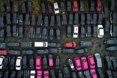 London taxi drivers say they are on their knees as unused cabs remain dormant in fields outside London. Getty Images