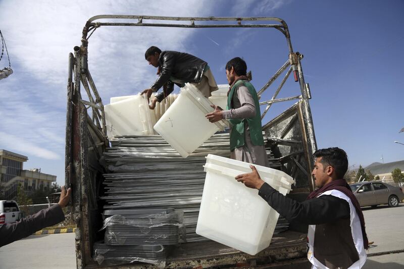 Election workers load ballot boxes on a truck in Kabul. AP Photo