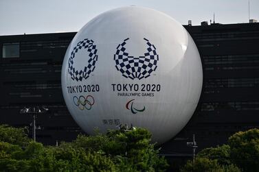 (FILES) In this file photo the Tokyo 2020 Olympic and Paralympic logos are displayed on the Hinomaru driving school building in Tokyo on June 29, 2020. US Olympic and Paralympic Committee officials said July 15, 2020 they have added three independent mental health officers to support American athletes ahead of next year's Tokyo Olympics. US Olympians were set to be competing next week in Japan before the global coronavirus pandemic forced the Games to be postponed to 2021. / AFP / CHARLY TRIBALLEAU