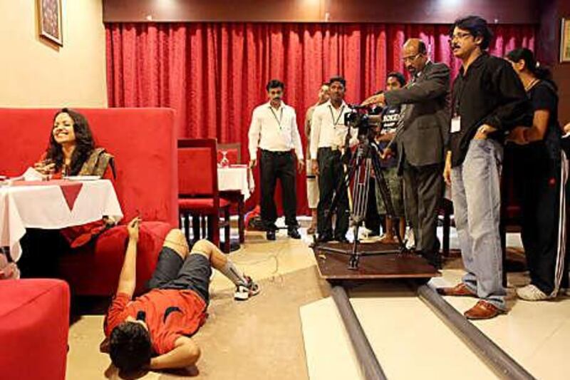 Rajah Balakrishna of the India Social and Cultural Centre shoots a scene as part of the filmmaking summer school, an annual event in which youngsters ages 7-17 can hone their acting and directorial skills.