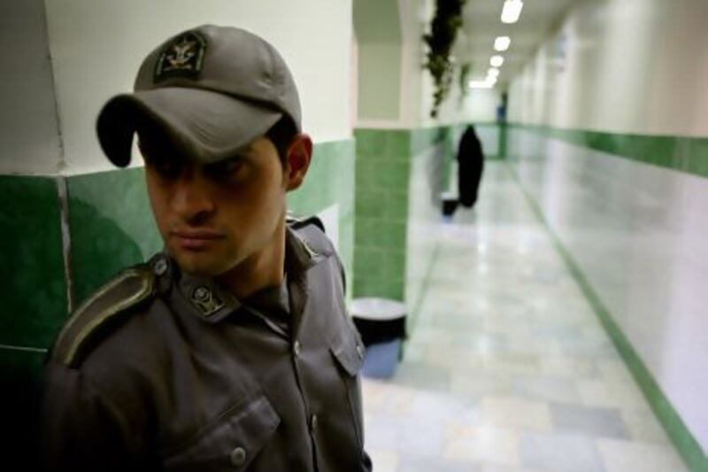A guard stands along a corridor in Tehran's Evin prison. Reuters
