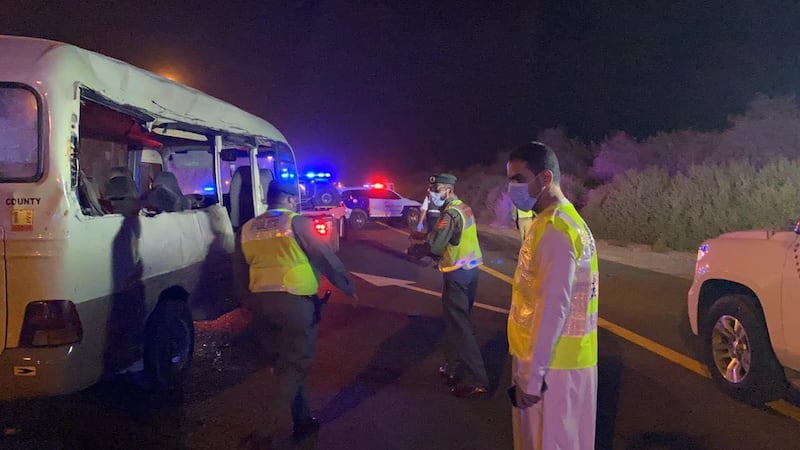 Police at the scene of the crash at Emirates Road on Saturday. Courtesy: Dubai Police