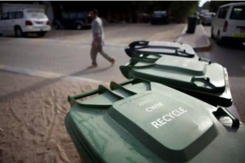 Thousands of villas across Abu Dhabi were given green and black bins to separate recycables and rubbish. Residents of high-rise buildings are now keen to get similar eco-friendly waste-disposal options. Silvia Razgova / The National