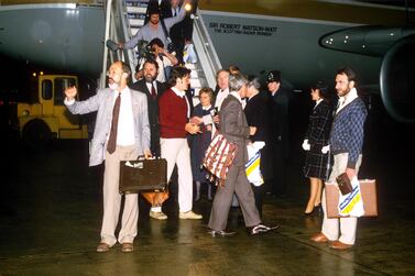 Terry Waite at Gatwick Airport with freed Libyan hostages in 1985. Shutterstock