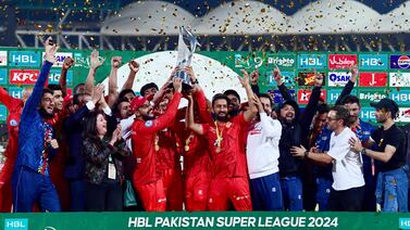 Islamabad United players lift the Pakistan Super League trophy as they celebrate their victory against Multan Sultans. AFP