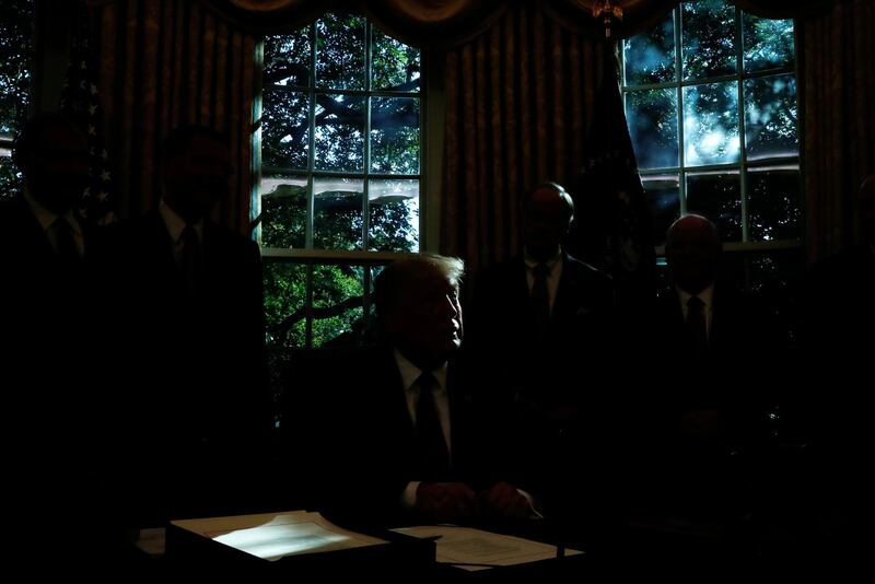 US President Donald Trump speaks during a bill signing event for 'America's Water Infrastructure Act of 2018' in the Oval Office at the White House in Washington. Reuters