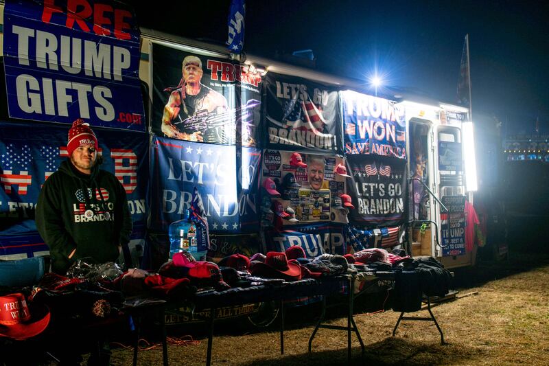A Trump supporter sells merchandise during the Save America rally at the Montgomery County Fairgrounds in Conroe, Texas. Getty Images / AFP
