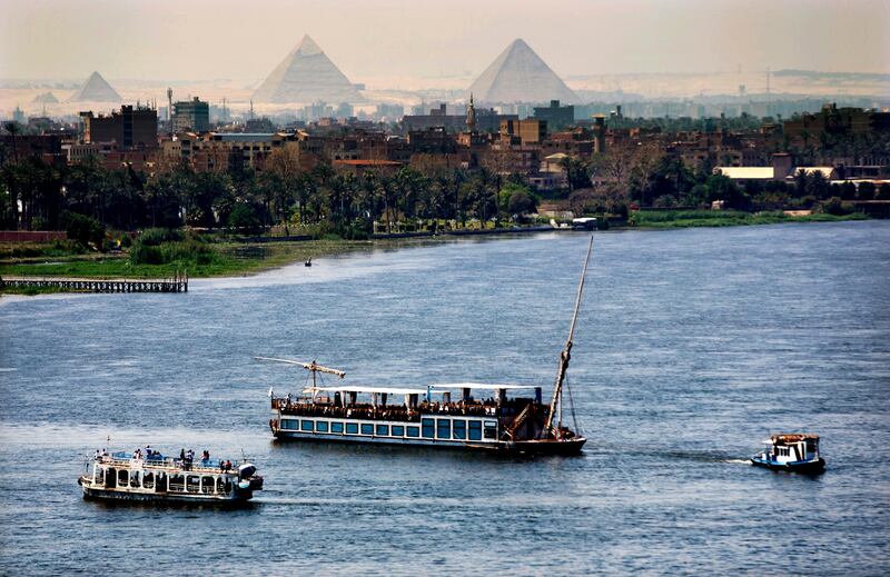 FILE - In this Monday, April 17, 2017 file photo, Holiday makers enjoy Nile cruises during Sham el-Nessim, or "smelling the breeze," in Cairo, Egypt.  The only reason Egypt has ever existed from ancient times until today is because of the Nile River, which provides a thin, fertile strip of green through the desert. For the first time, the country fears a threat to that lifeline, as Ethiopia rushes to finish a massive hydroelectric dam.(AP Photo/Amr Nabil, File)