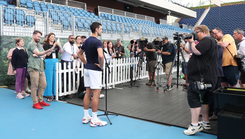 Novak Djokovic talks to the media after a practice session at Memorial Drive. Getty