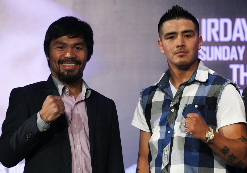 Manny Pacquiao and Brandon Rios at the fight announcement in July. Tyrone Siu / Reuters