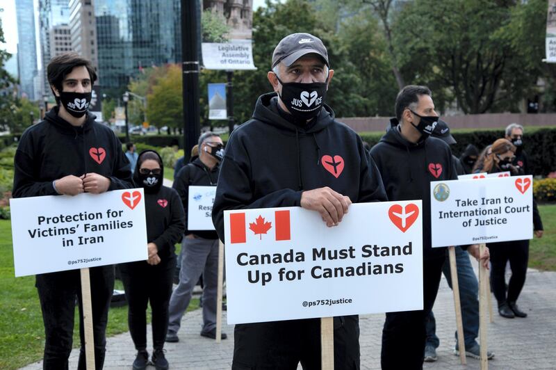 Families who lost loved ones in the destruction of Flight PS752 held protests today in Toronto, Canada on October 5, 2020. Iran's military shot down the Ukraine International Airlines flight shortly after takeoff in Tehran on Jan. 8, killing all 176 passengers onboard -- including 55 Canadian citizens and 30 permanent residents.  (Photo by Sayed Najafizada/NurPhoto via Getty Images)