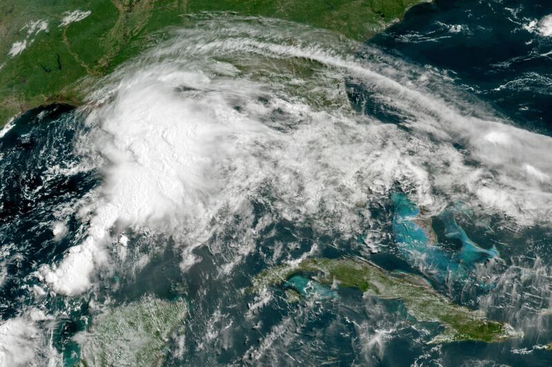This GOES-16 GeoColor satellite image taken Friday shows a tropical weather system in the Gulf of Mexico.. NOAA via AP
