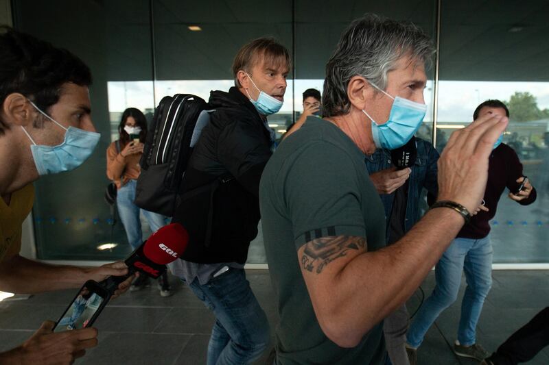 Lionel Messi's father and representative Jorge Messi (C) arrives at El Prat Airport in Barcelona. Jorge Messi will meet Barcelona's president Josep Maria Bartomeu to talk about the future of his son after Messi's decision to leave the club. EPA