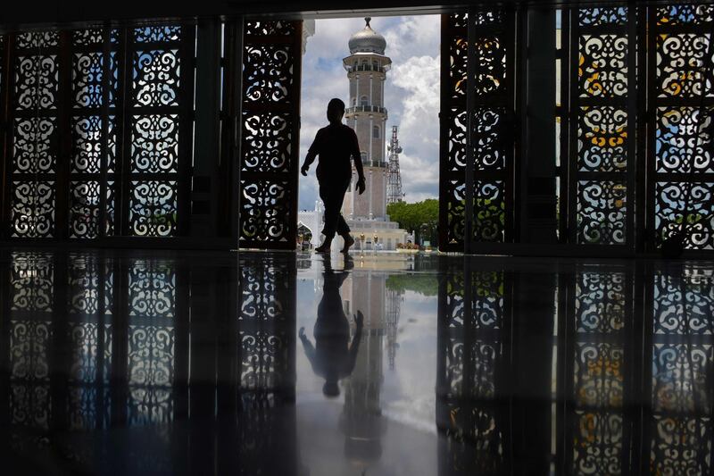 A Muslim man enters Baiturrahman grand mosque in Banda Aceh.  AFP