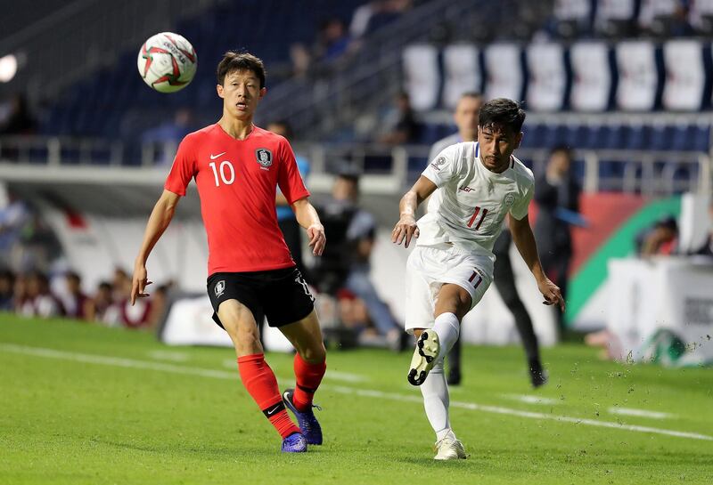 DUBAI , UNITED ARAB EMIRATES , January  7 – 2019 :- Lee Jaesung ( no 10 in red ) of Korea Republic and Daisuke Sato ( no 11 in white ) of Philippines in action during the AFC Asian Cup UAE 2019 football match between KOREA REPUBLIC vs. PHILIPPINES held at Al-Maktoum Stadium in Dubai. Korea Republic won the match by 1-0. ( Pawan Singh / The National ) For News/Sports