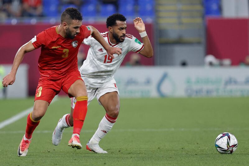 Syria defender Diaa Al Mohammad marks UAE midfielder Tahnoon Al Zaabi. AFP