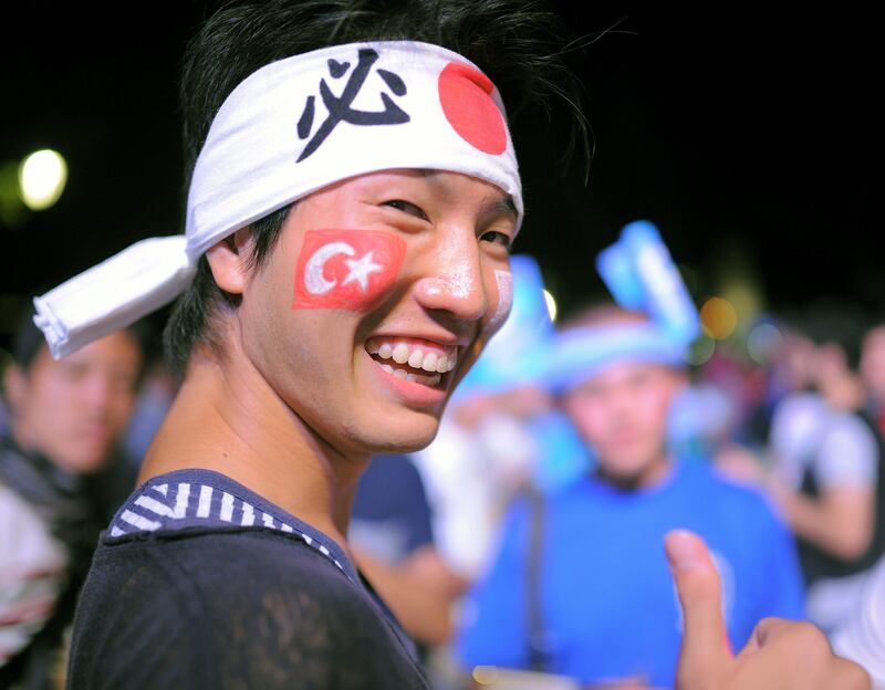 A Japanese tourist reacts  in Sultan Ahmed Square in Istanbul, Turkey, Saturday, Sept. 7, 2013 after Tokyo won the right to host the Olympics. The International Olympic Committee voted  in Buenos Aires, Argentina, late Saturday, for Tokyo  to host the 2020 Summer Olympics, over Istanbul and Madrid.(AP Photo) *** Local Caption ***  Turkey Olympics 2020 .JPEG-0c492.jpg