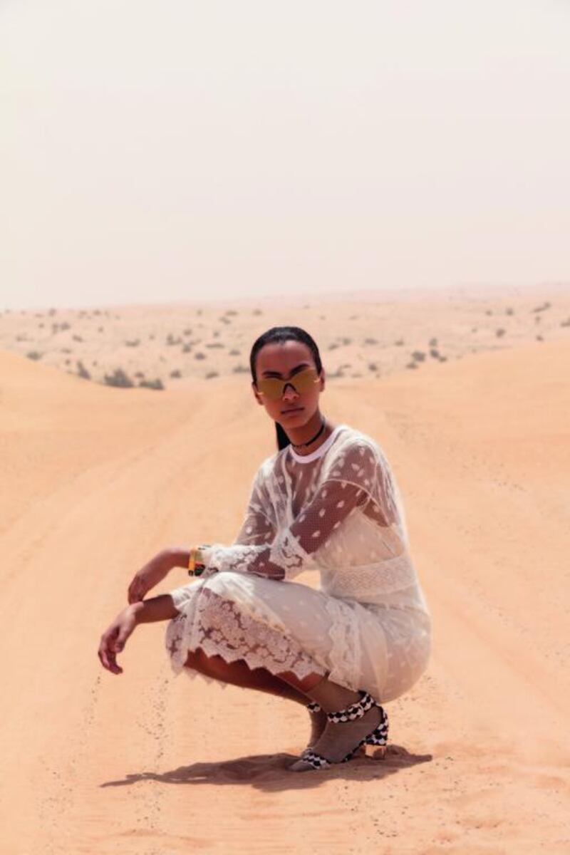 Sands of time: Dress, Dh9,495, Burberry. Heels, Dh2,800, Roger Vivier. Sunglasses, Dh999, Glassing. Choker, Dh1,200, Christian Dior. Bangle (right), Dh3,470; bangle (left), Dh2,490, both from Hermès