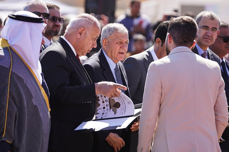 Iraq's President Abdul Latif Rashid, third from left, at the festival. He signed a document pledging to restore the city's cultural status internationally. Ismael Adnan for The National