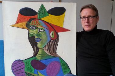 Dutch art detective Arthur Brand with 'Buste de Femme', a recovered Picasso painting. The painting was stolen from a wealthy Saudi Arabian's yacht 20 years ago. He has since returned the work, which he estimates to be worth some 25 million euros ($28 million) to an insurance company. Photo: AP 