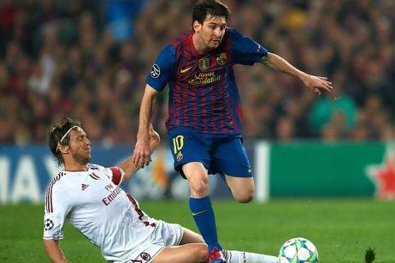 The defence of AC Milan will be up against Barcelona's Lionel Messi, right, after the two teams met four times last year.