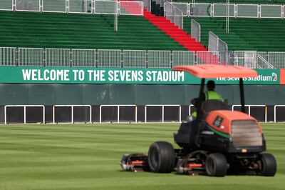 The grass is prepared in the stadium before the Emirates Rugby Sevens. Chris Whiteoak / The National