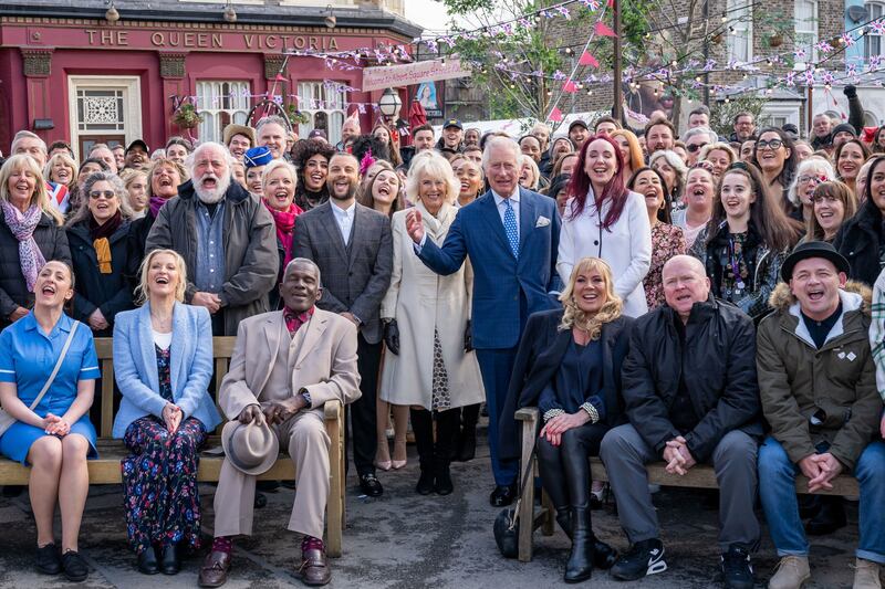 Britain's Prince Charles and Camilla, Duchess of Cornwall pose for a group photo with the cast and crew during a visit to the set of EastEnders at the BBC studios in Elstree, Hertfordshire, Britain March 31, 2022.  Picture taken March 31, 2022.  Aaron Chown / Pool via REUTERS