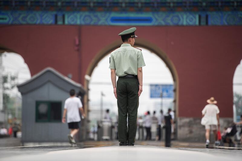 A Chinese paramilitary policeman stands guard prior to the arrival of French prime minister Edouard Philippe. Fred Dufour / Pool / EPA