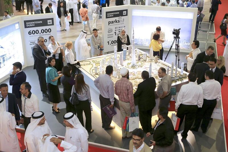 Visitors view Emaar’s Downtown Dubai model. Sarah Dea / The National