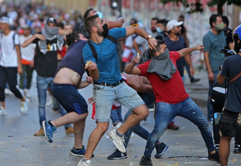 The security forces clash with demonstrators near Lebanon's parliament building in Downtown Beirut.
