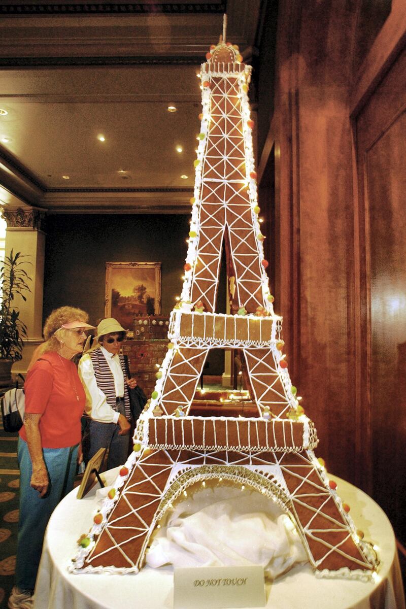 SAN DIEGO, CA - DECEMBER 6:  Hotel visitors view a replica of a seven-foot gingerbread Eiffel Tower on display in the lobby of the U.S. Grant Hotel December 6, 2002 in San Diego, California.  The structure was part of the Gingerbread City 2002 contest, which raised money for the Epilepsy Foundation of San Diego County and were designed by local chefs, designers and artists. This year's theme was "Architecture Through the Ages" and featured a seven-foot Eiffel Tower, Egyptian Pyramids, a replica of the Chrystler Building, along with other structures.  (Photo by Sandy Huffaker/Getty Images)   