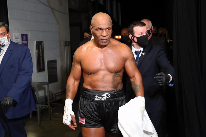 Nov 28, 2020; Los Angeles, CA, USA;  Mike Tyson (black trunks) exits the ring after his split draw against Roy Jones, Jr. (white trunks) during a heavyweight exhibition boxing bout for the WBC Frontline Belt at the Staples Center.  Mandatory Credit: Joe Scarnici/Handout Photo via USA TODAY Sports