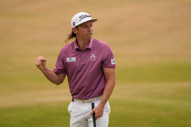 Cameron Smith celebrates after putting on the 18th green. AP