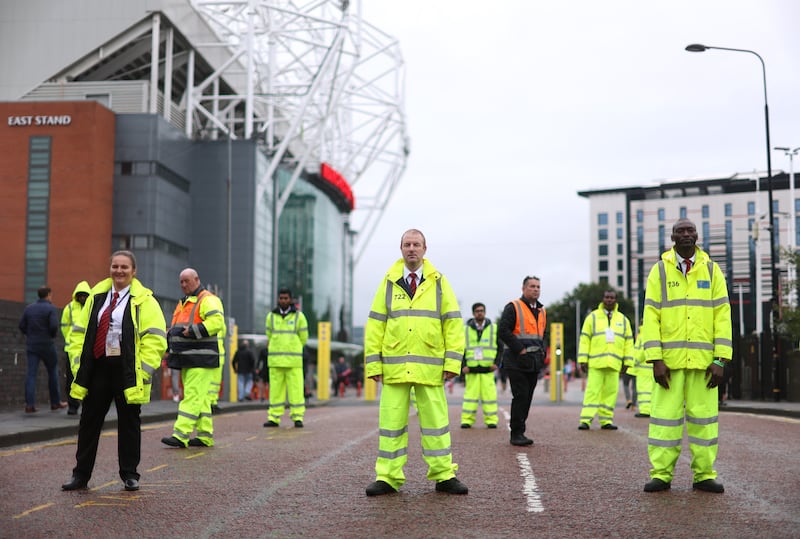 Stewards outside the stadium before the match against Liverpool. Action Images